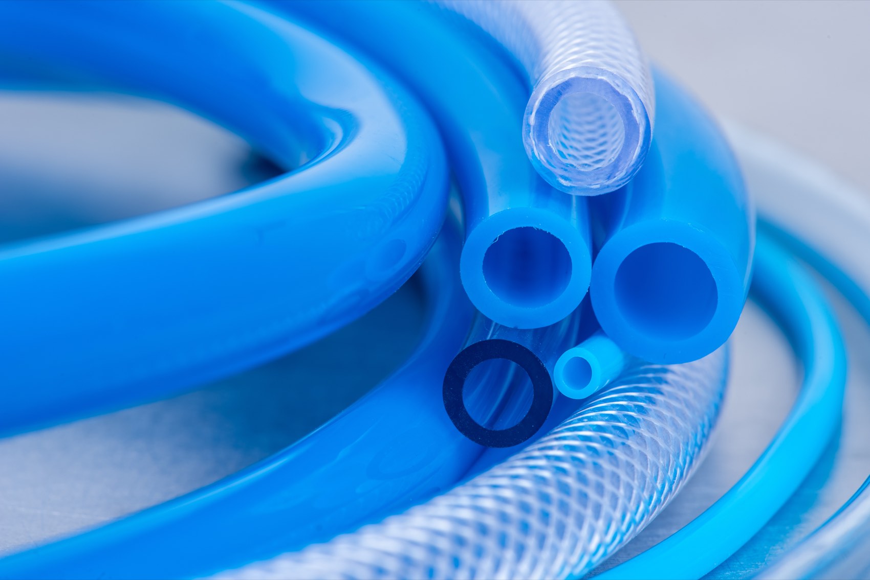 Coils of blue and clear flexible PVC tubing