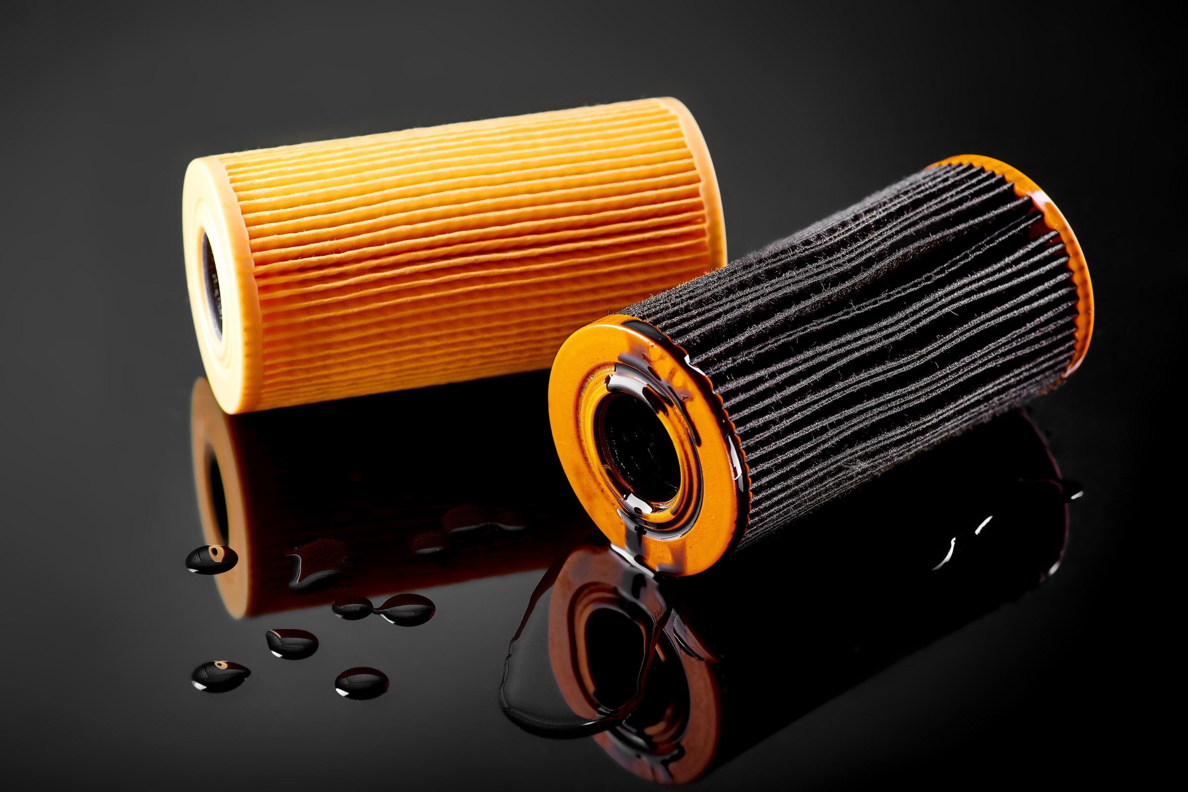 Cartridge oil filter elements with molded end caps