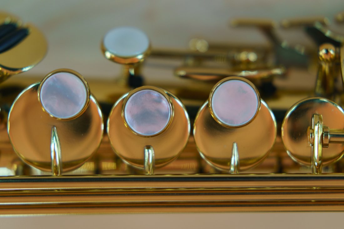 Close-up of saxophone keys and pads, installed with shellac adhesive