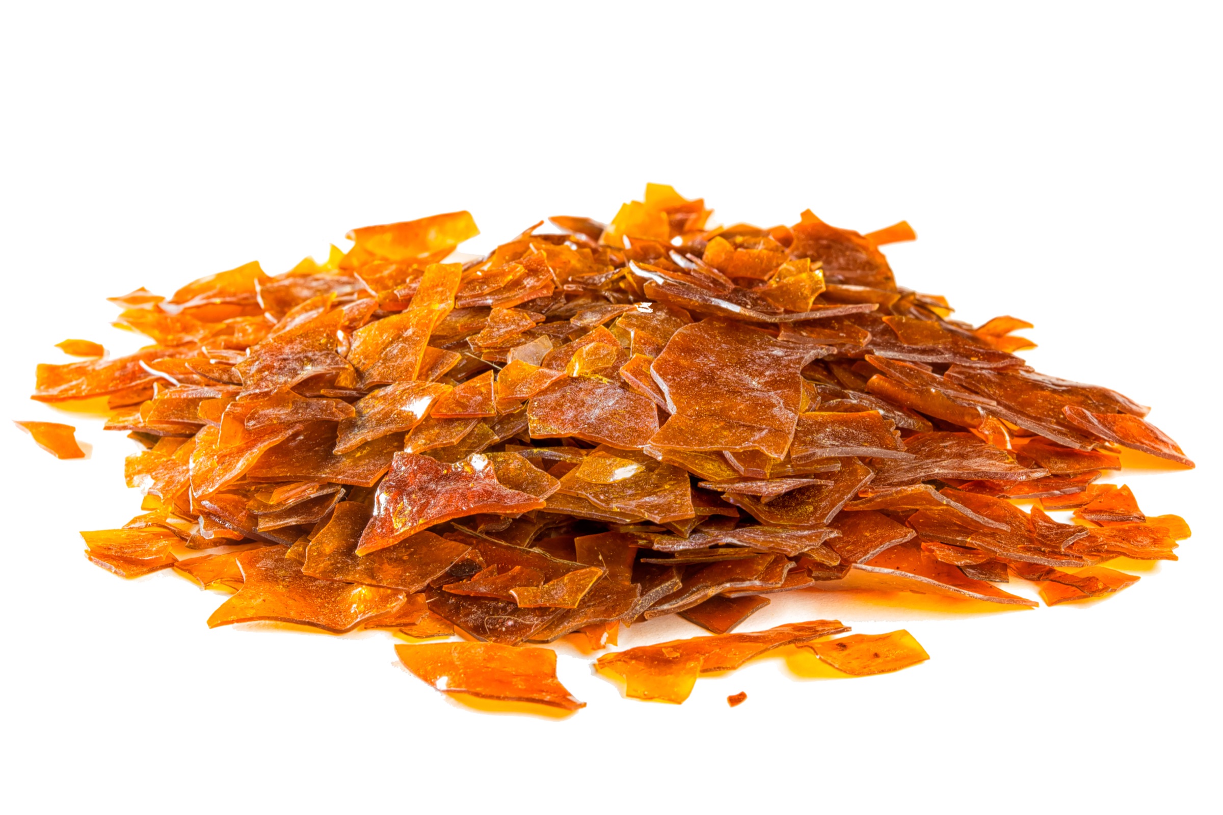 Pile of amber Lemon shellac flakes