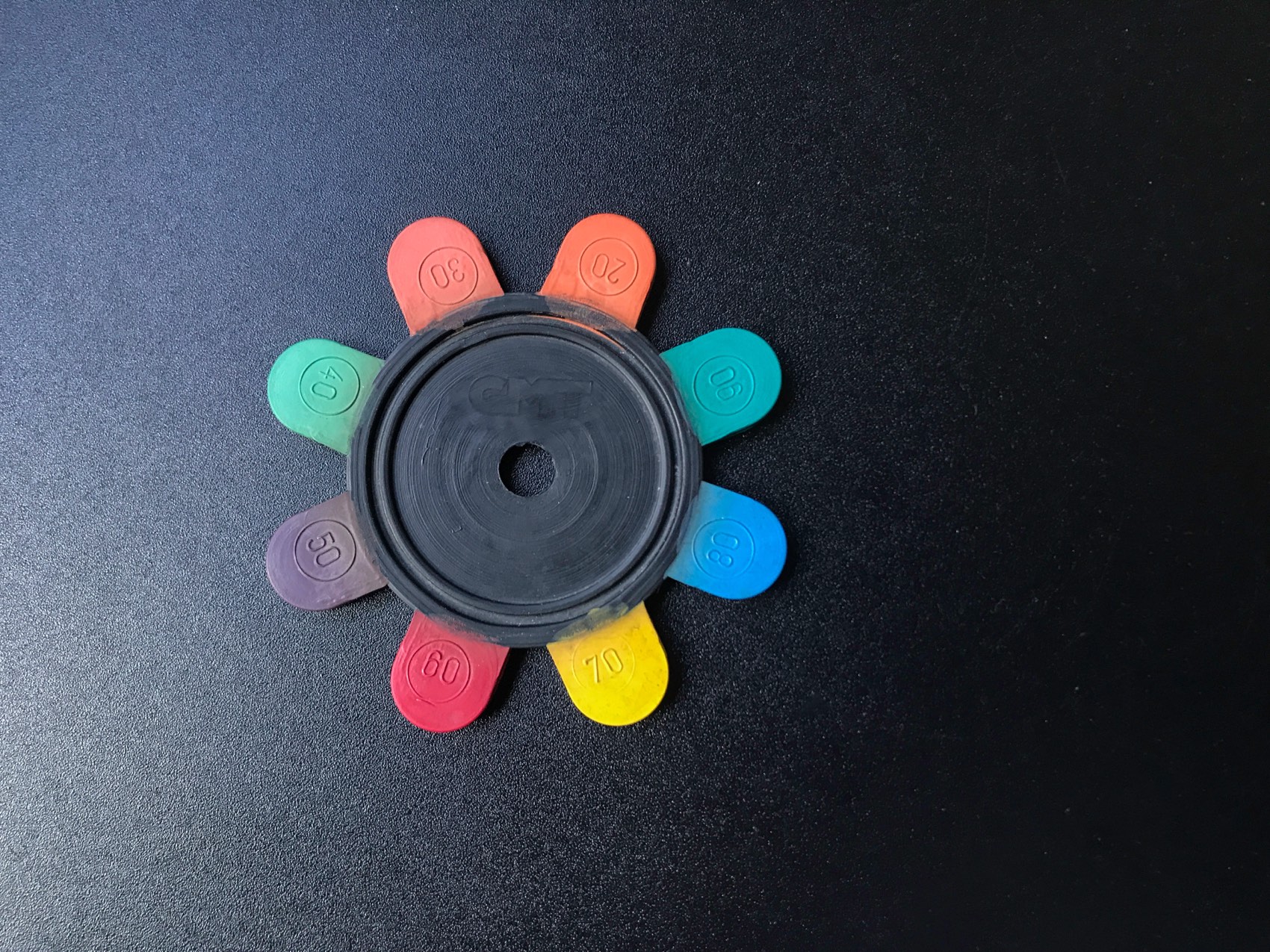 Shore A hardness samples from 20 to 90 arranged around a rubber wheel